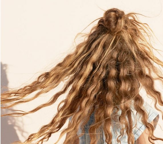 How to Tame Frizzy Hair This Summer - OrangeTwist