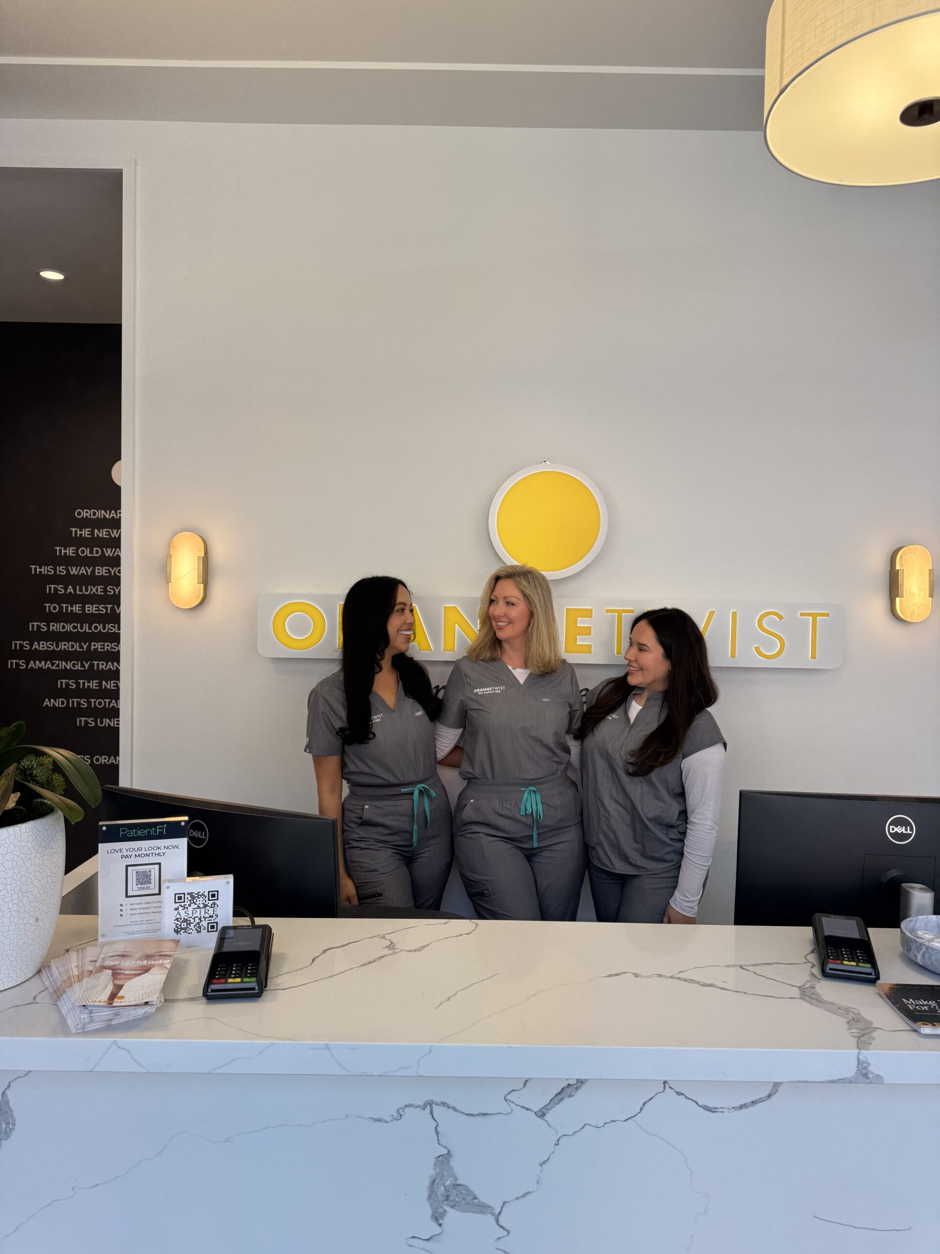 staff smiling behind desk 1 scaled Fort Worth - Alliance Town Center