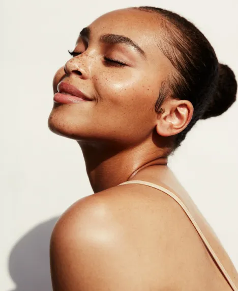 Woman in sun smiling