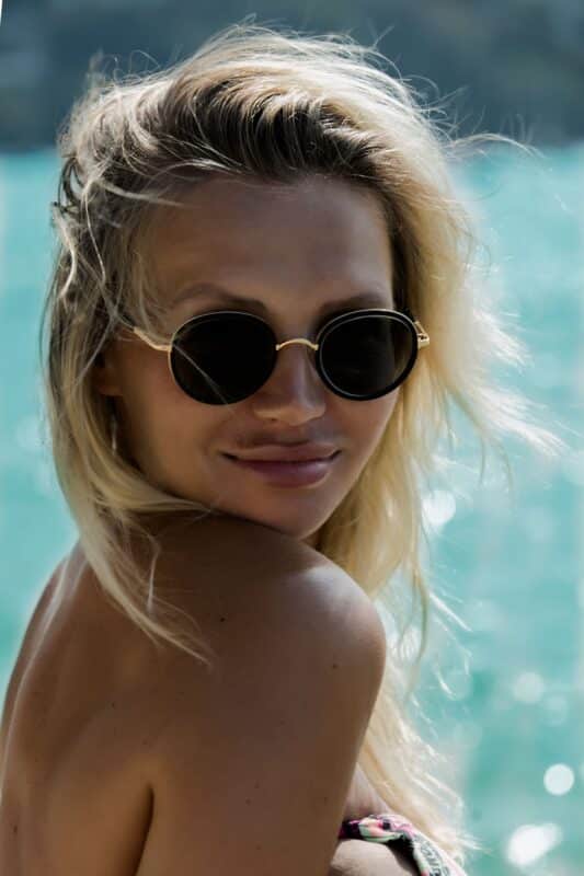 Model-in-sunglasses-by-water