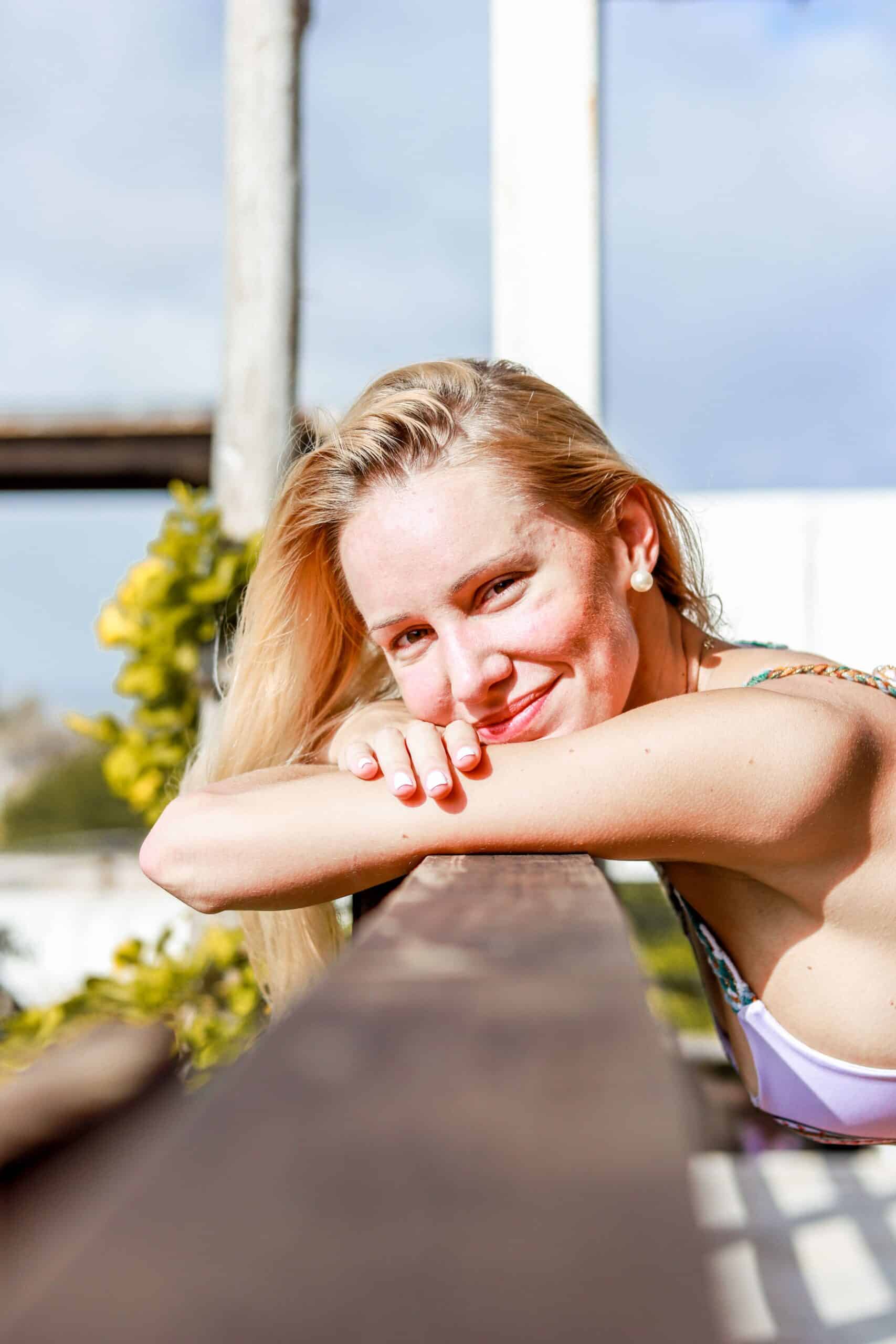 Model-leaning-against-rail