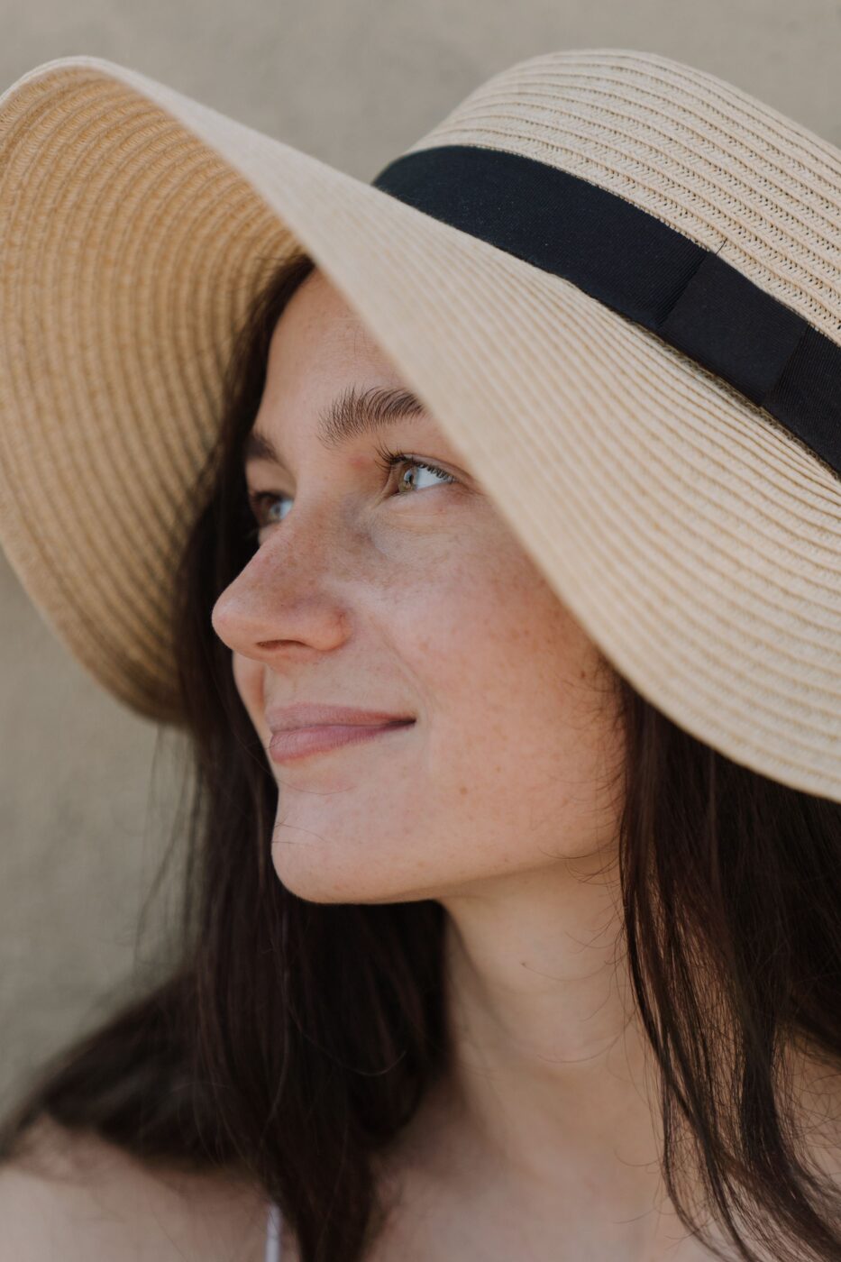 Model-in-rattan-hat-close-up